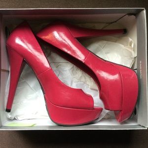Hot pink peep-toe platform pumps
